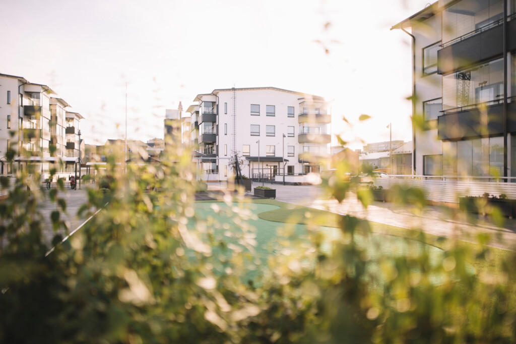 Apartment building in the background and park in the foreground.